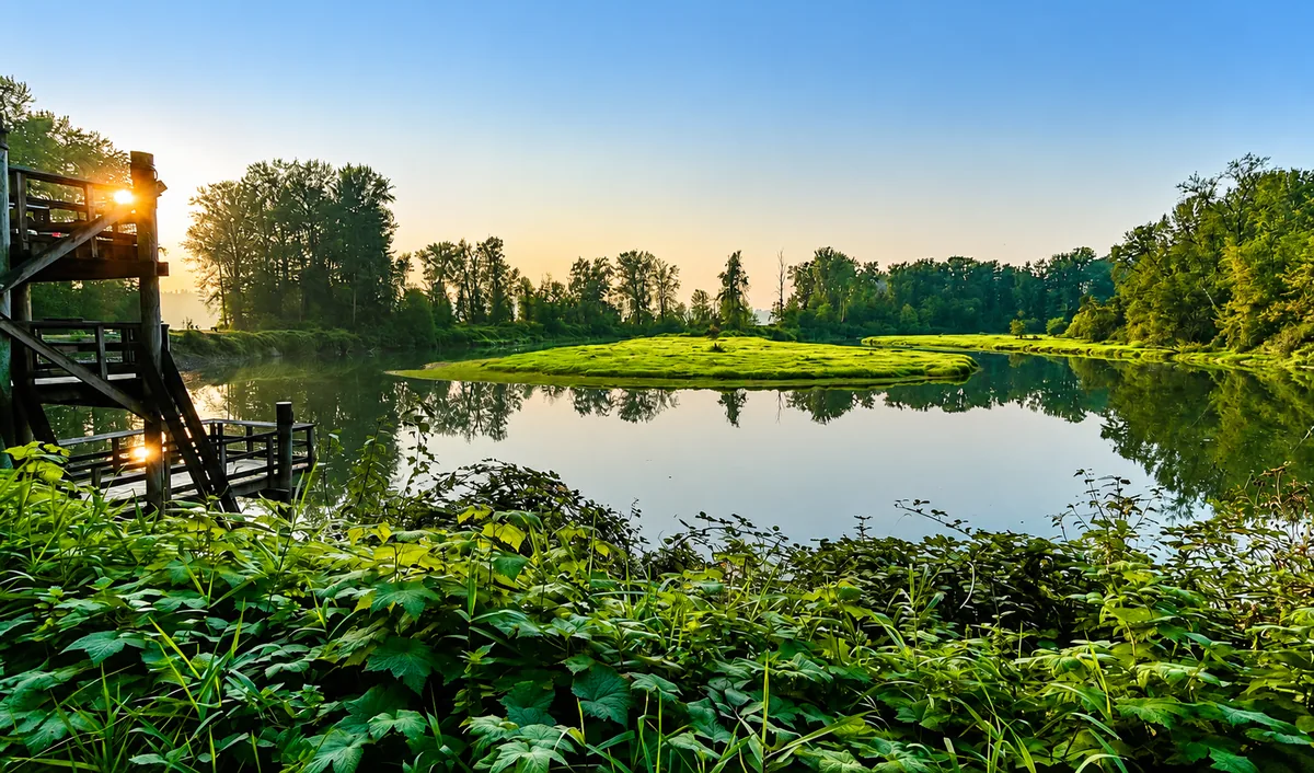 Sunrise over a river landscape in Maple Ridge